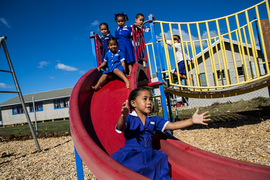 Children at the Maamatoa Kindergarten play on the play equipment during their lunch break.