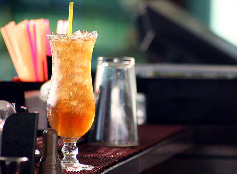 "A Long Island Iced Tea sits on the bar, waiting to be served.See other"
