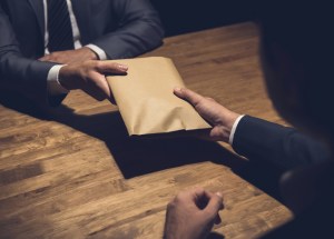 Two charged over alleged corrupt conduct