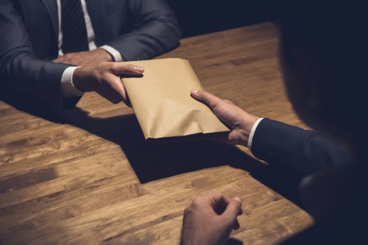 Two charged over alleged corrupt conduct